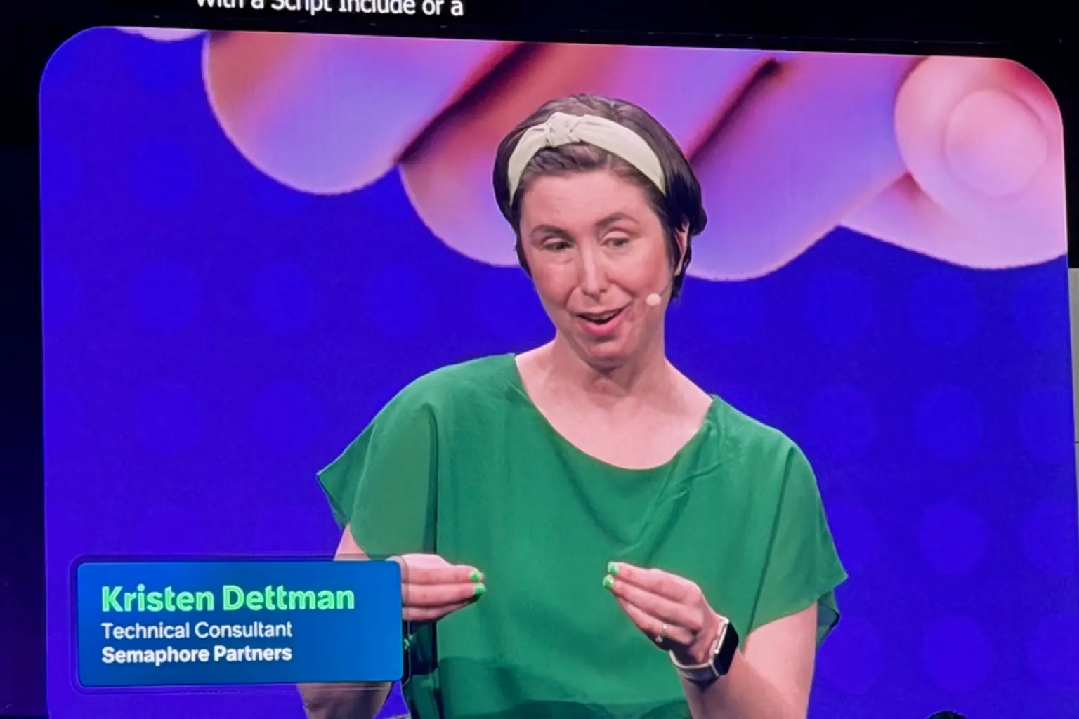 Kristen Dettman, Technical Consultant at Semaphore Partners, presenting on the main stage screen at Knowledge 2026